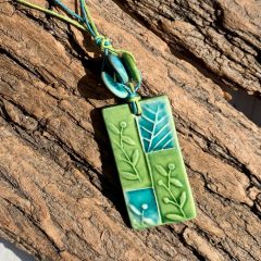 Green flute necklace